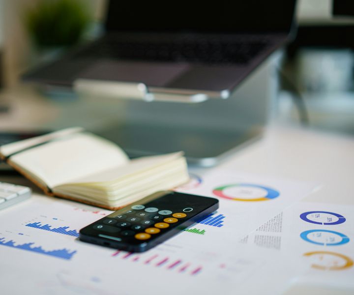 Desk with financial charts and papers layed out