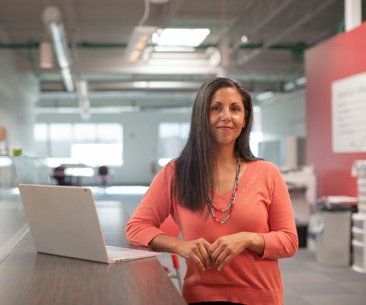 Woman business owner standing confidently in her store