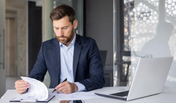 Business owner reviewing paperwork