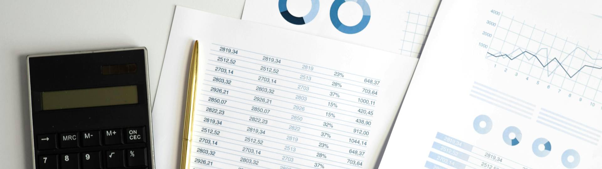 Financial paperwork with a calculator and pen